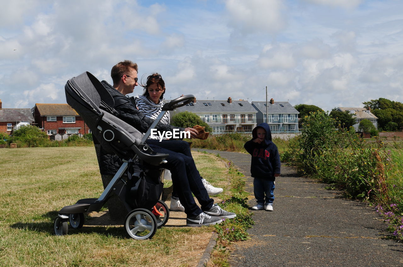 YOUNG MEN ON CART