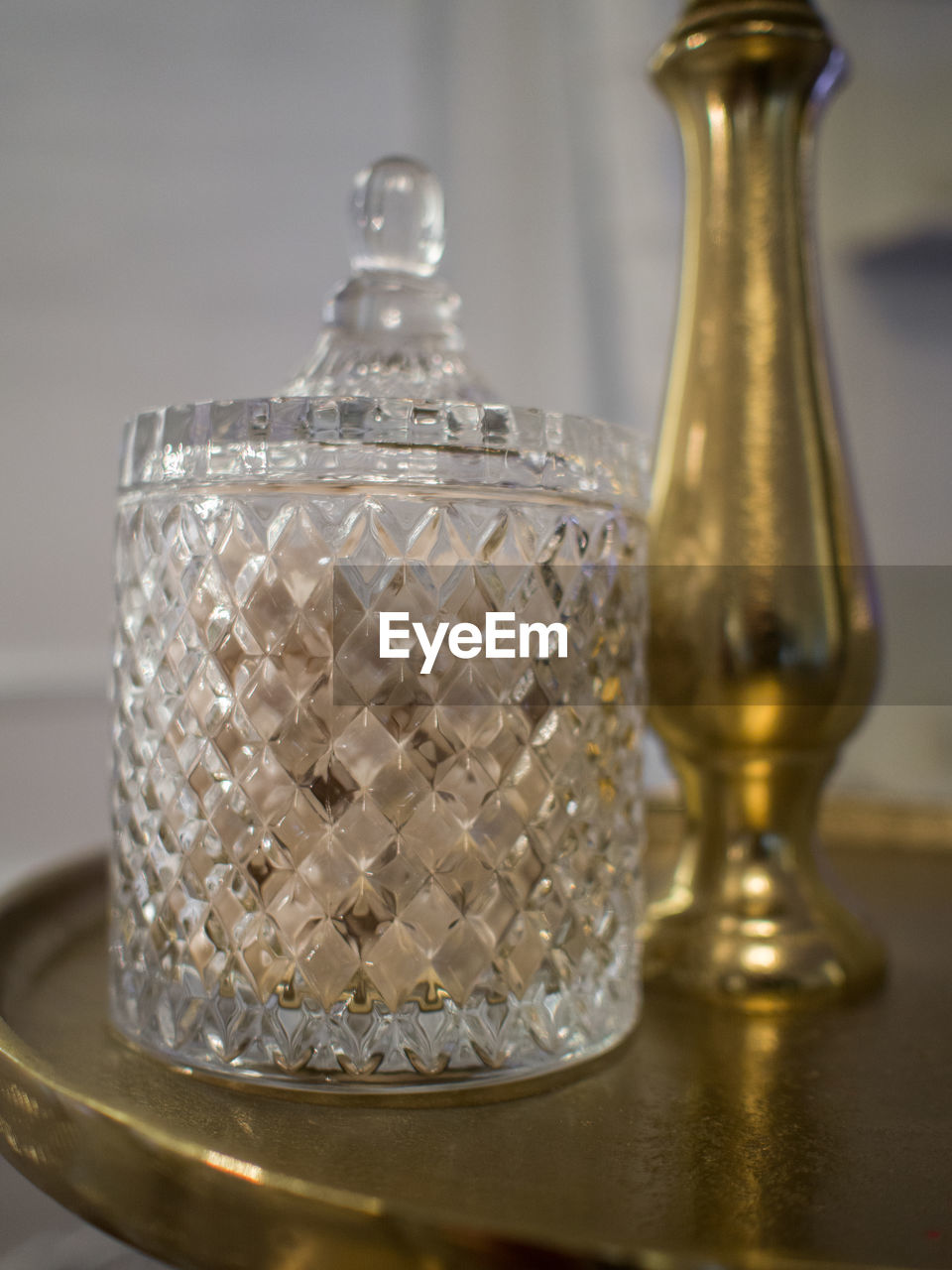 indoors, lighting, container, no people, wealth, luxury, glass, bottle, table, close-up, food and drink, household equipment, metal, elegance, glass bottle, studio shot, gold, still life, focus on foreground, shiny