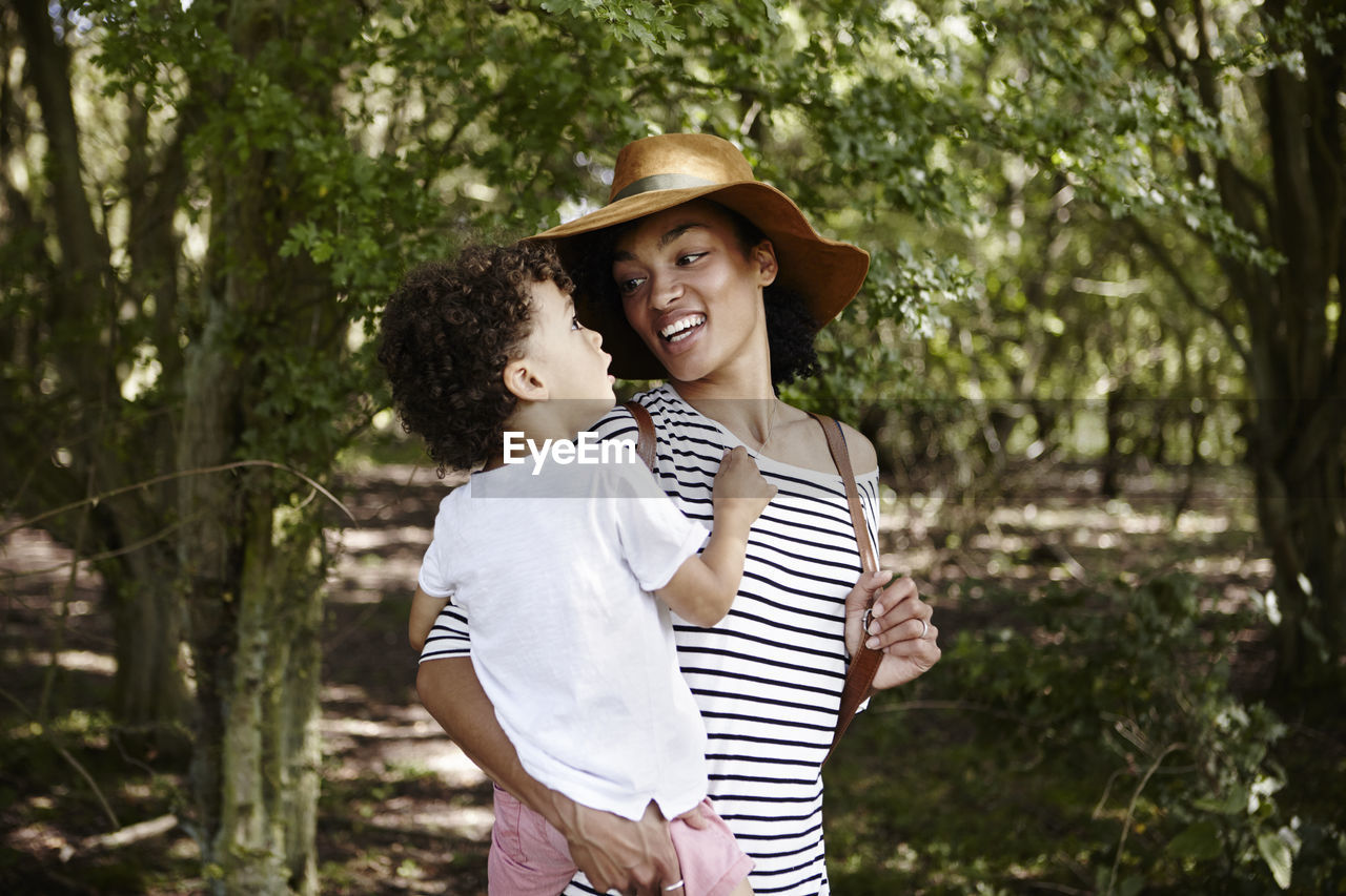 Mother with son in forest