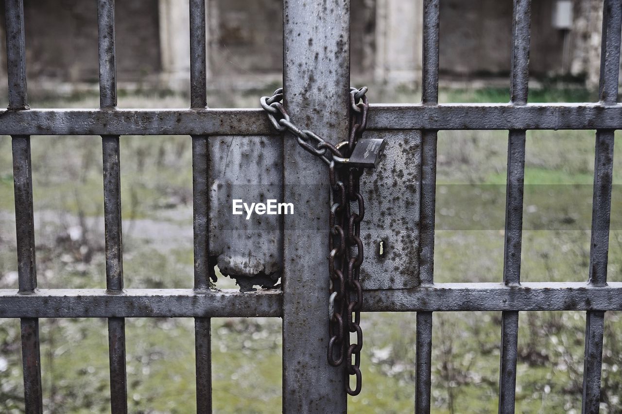 Close-up of chain hanging on gate