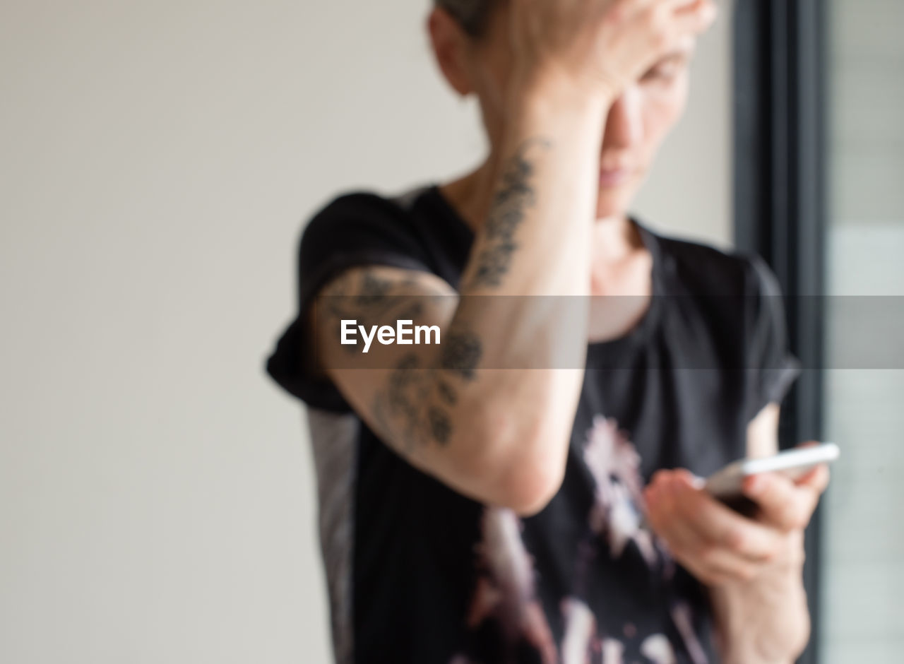 Close-up of woman using mobile phone