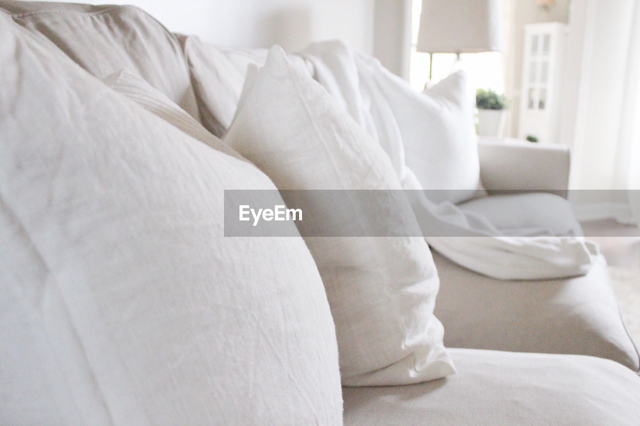 Close-up of cushion on sofa at home