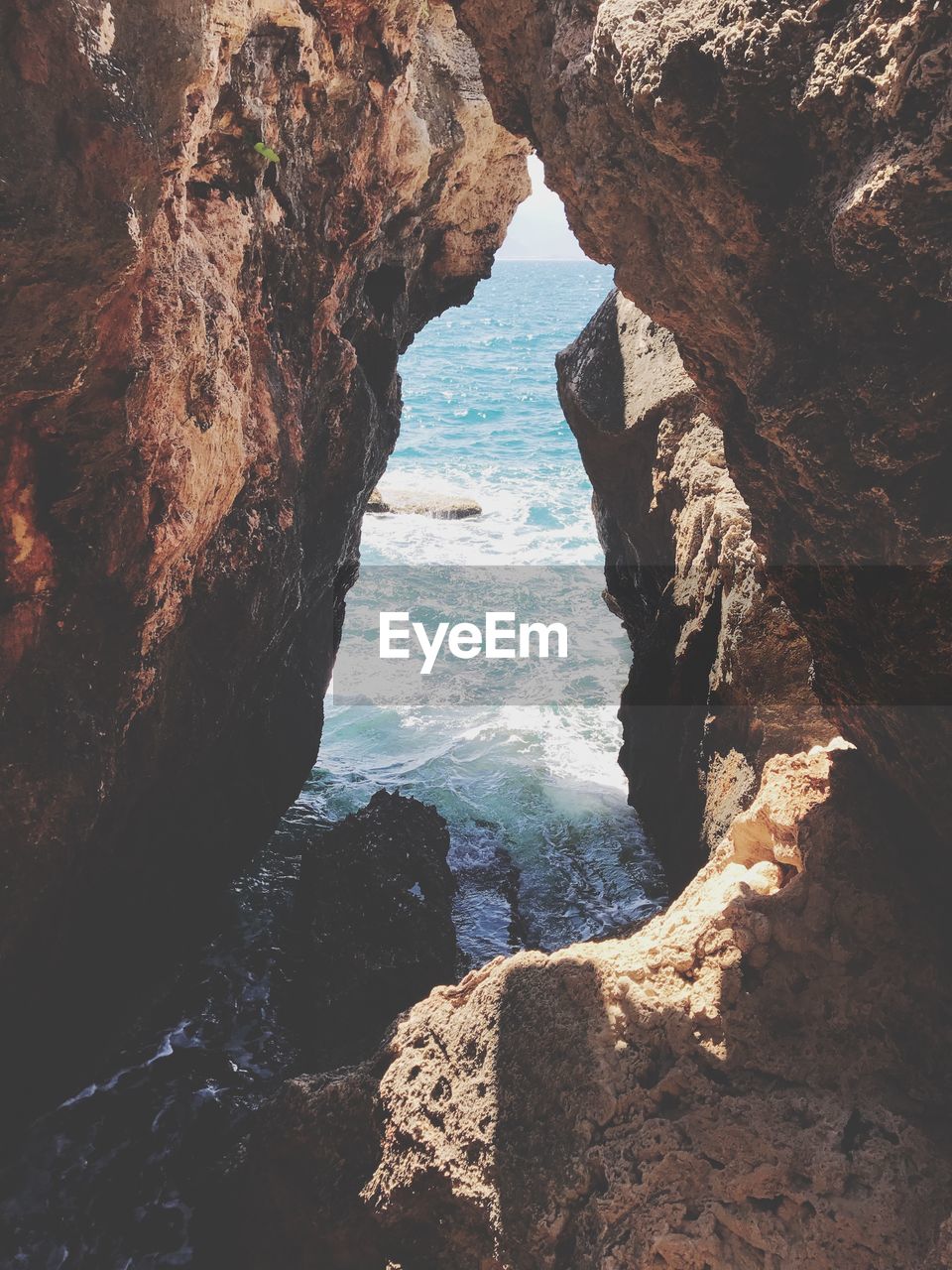 High angle view of rock formation over sea