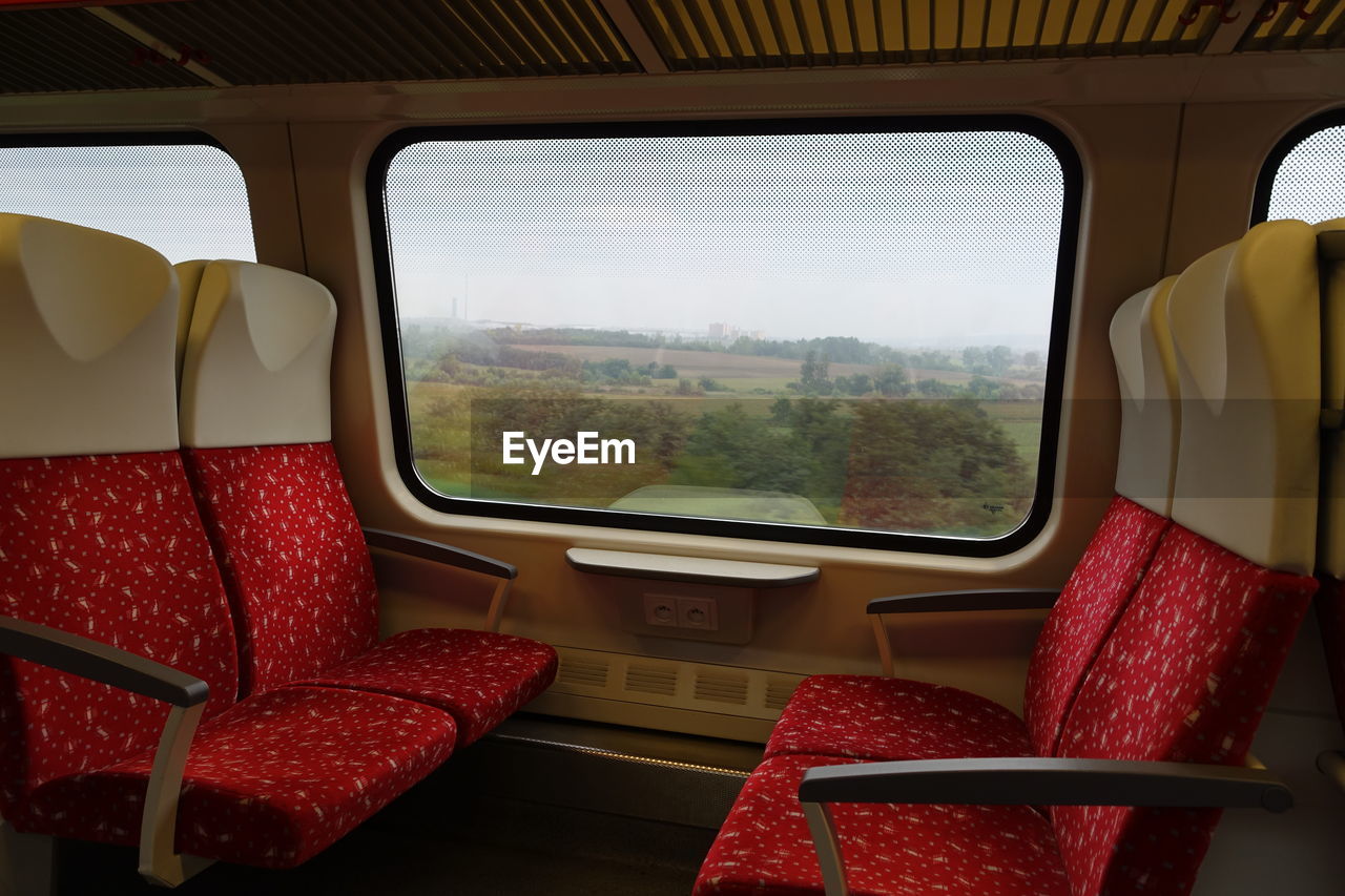 Empty seats by window in train