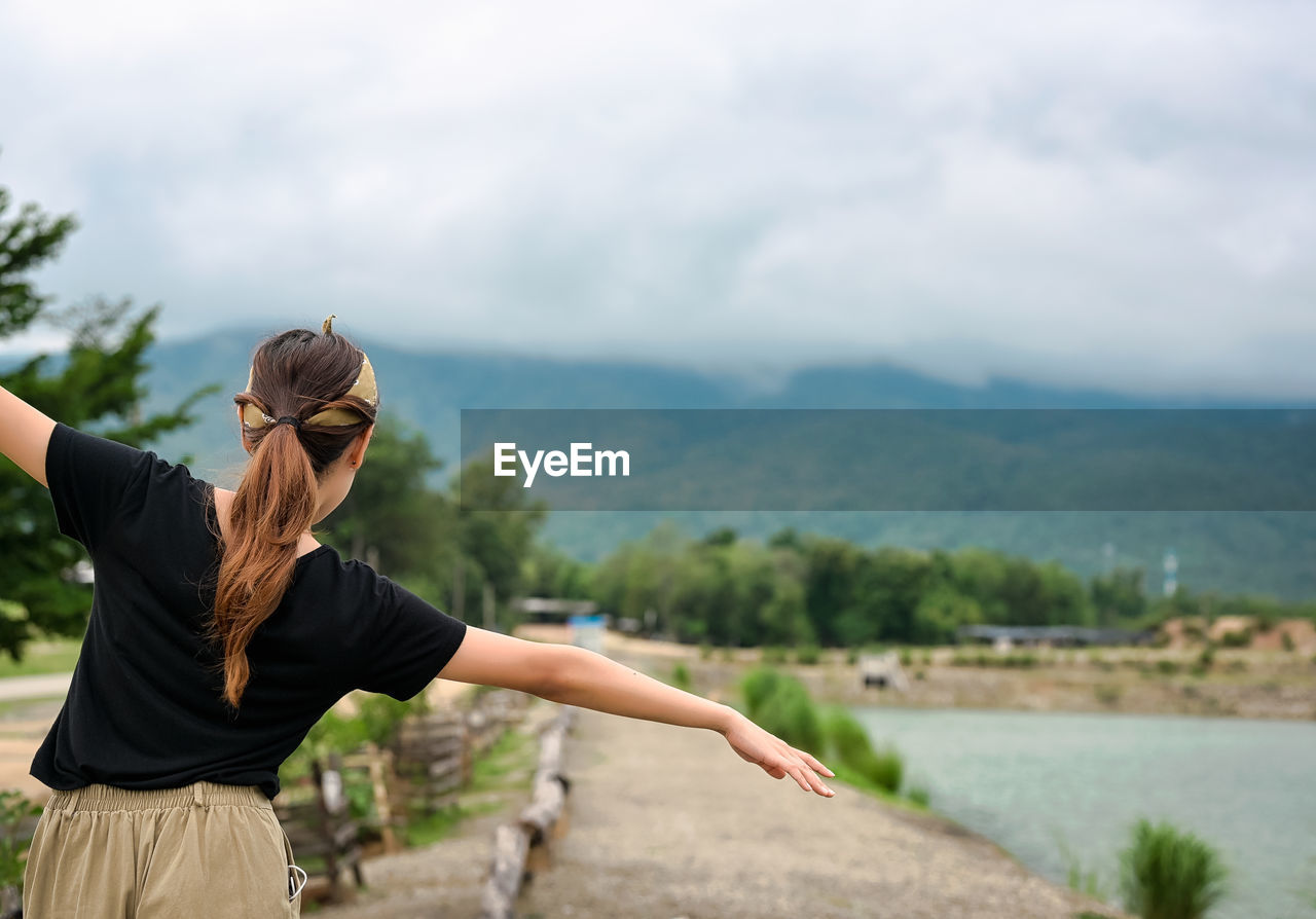 Back view point of young women walking and attempt to balance herself ,motivation recreation concept