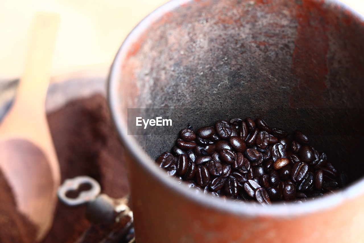 Close-up of roasted coffee beans in container