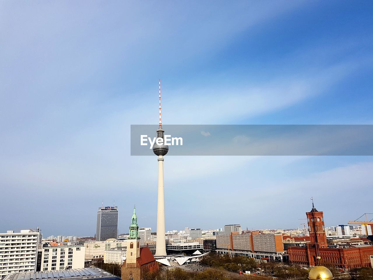 Tower amidst buildings in city against sky