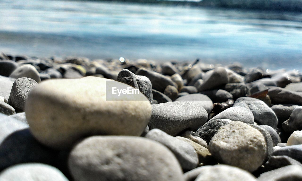 Close-up of stones on riverbank