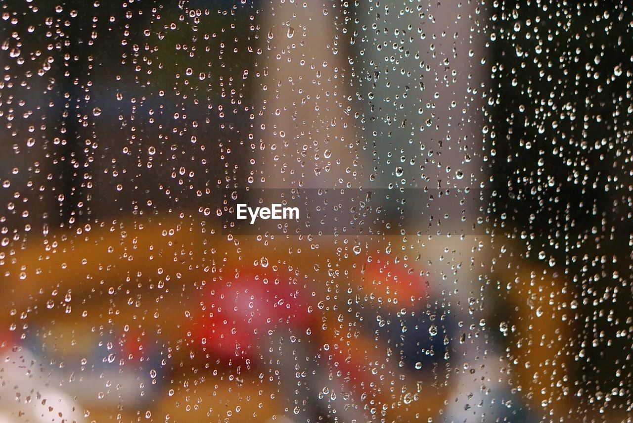 Full frame shot of raindrops on window