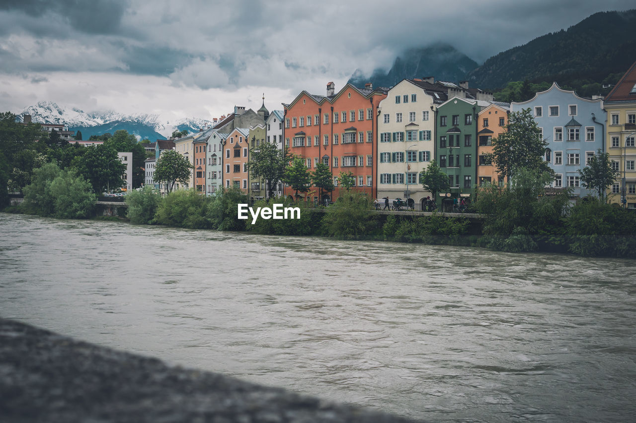 RIVER AND BUILDINGS AGAINST SKY