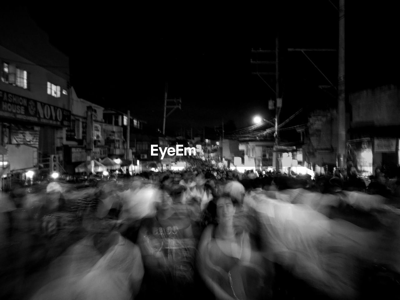 CROWD ON CITY STREET AT NIGHT