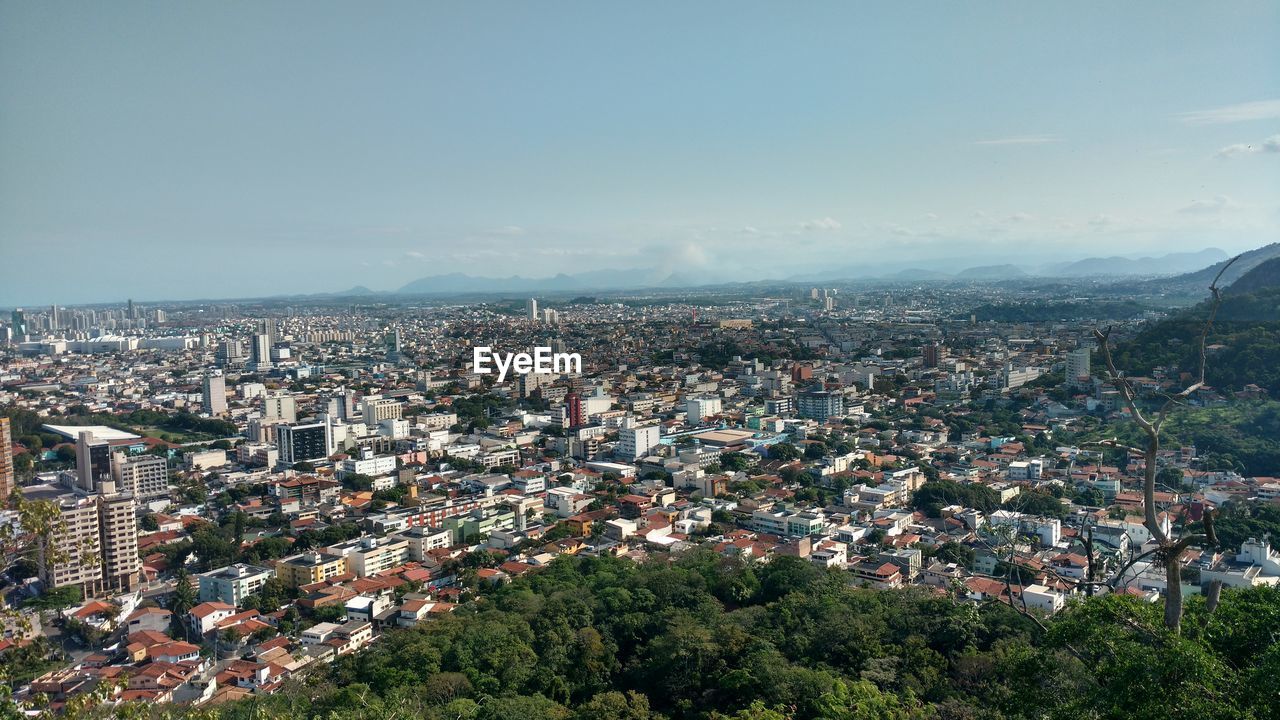 Aerial view of cityscape against sky