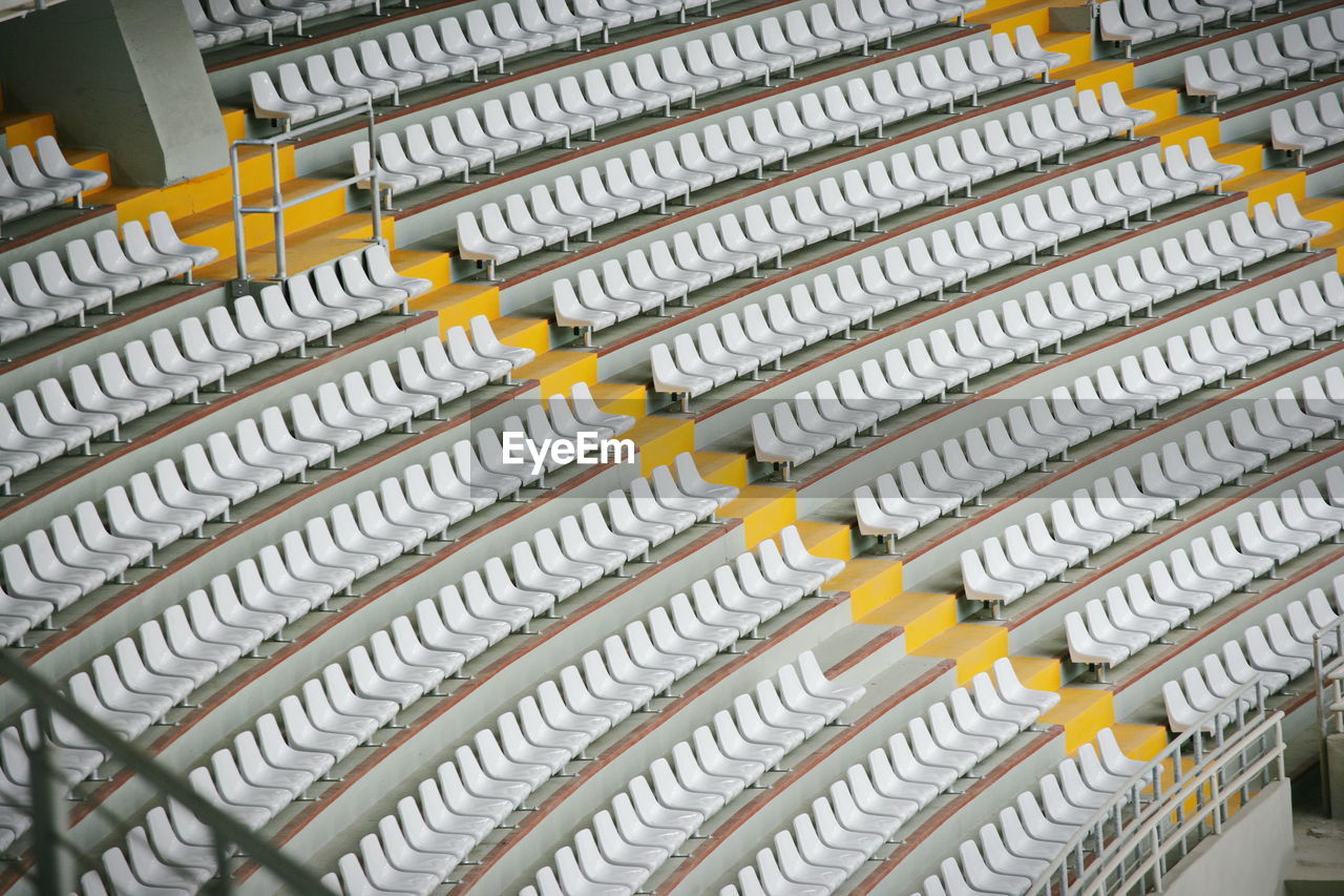 High angle view of empty chairs in stadium