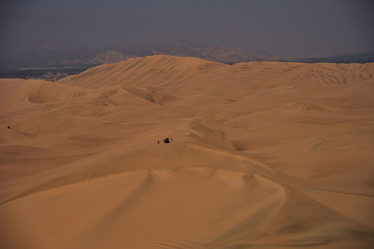 Buggy dune ride in huacachine desert - remote group of people