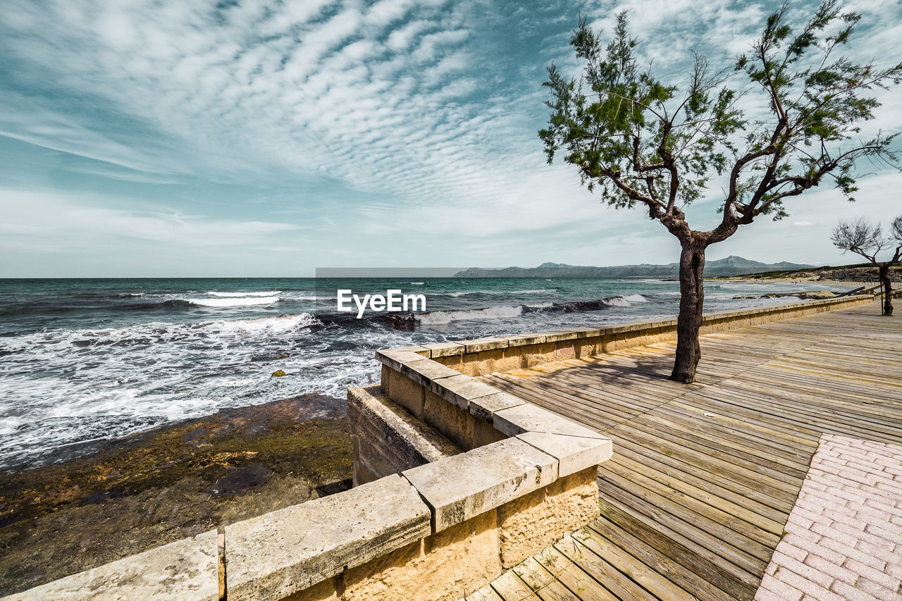 Scenic view of sea against cloudy sky