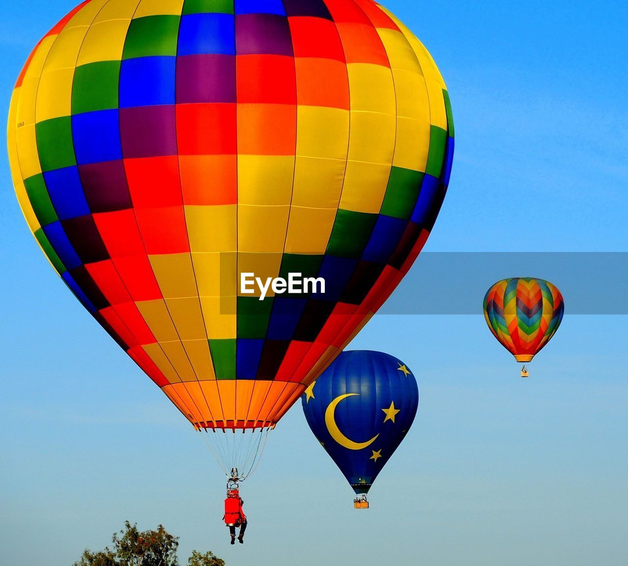 Hot air balloons flying against clear sky