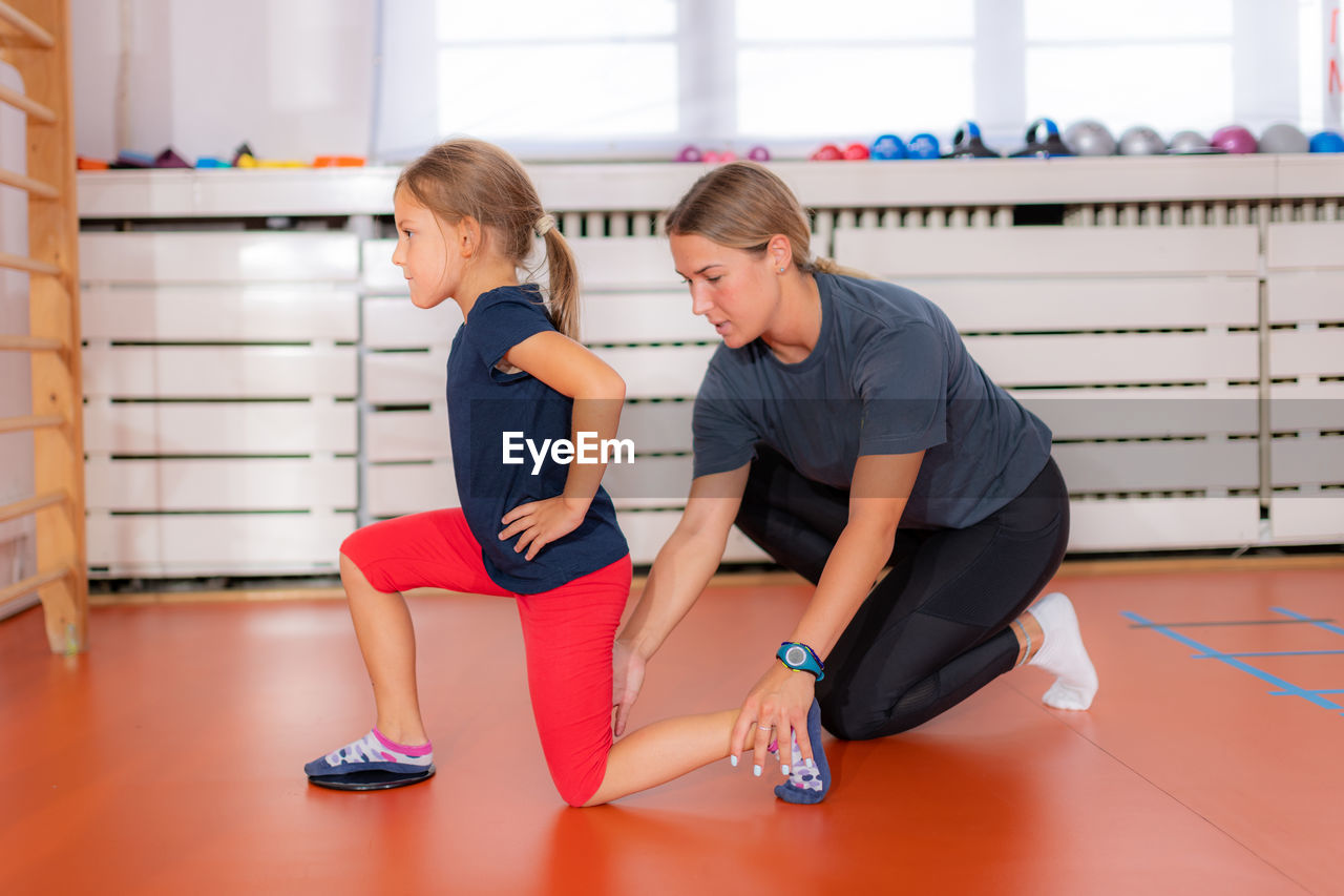 Children training with exercise gliders, improving balance and coordination skills