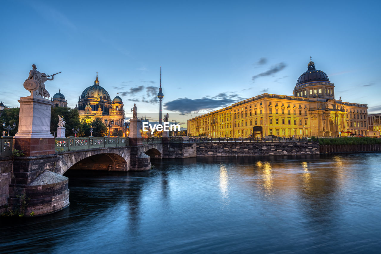 Panorama of the city palace, the cathedral and the tv tower in berlin at sunrise