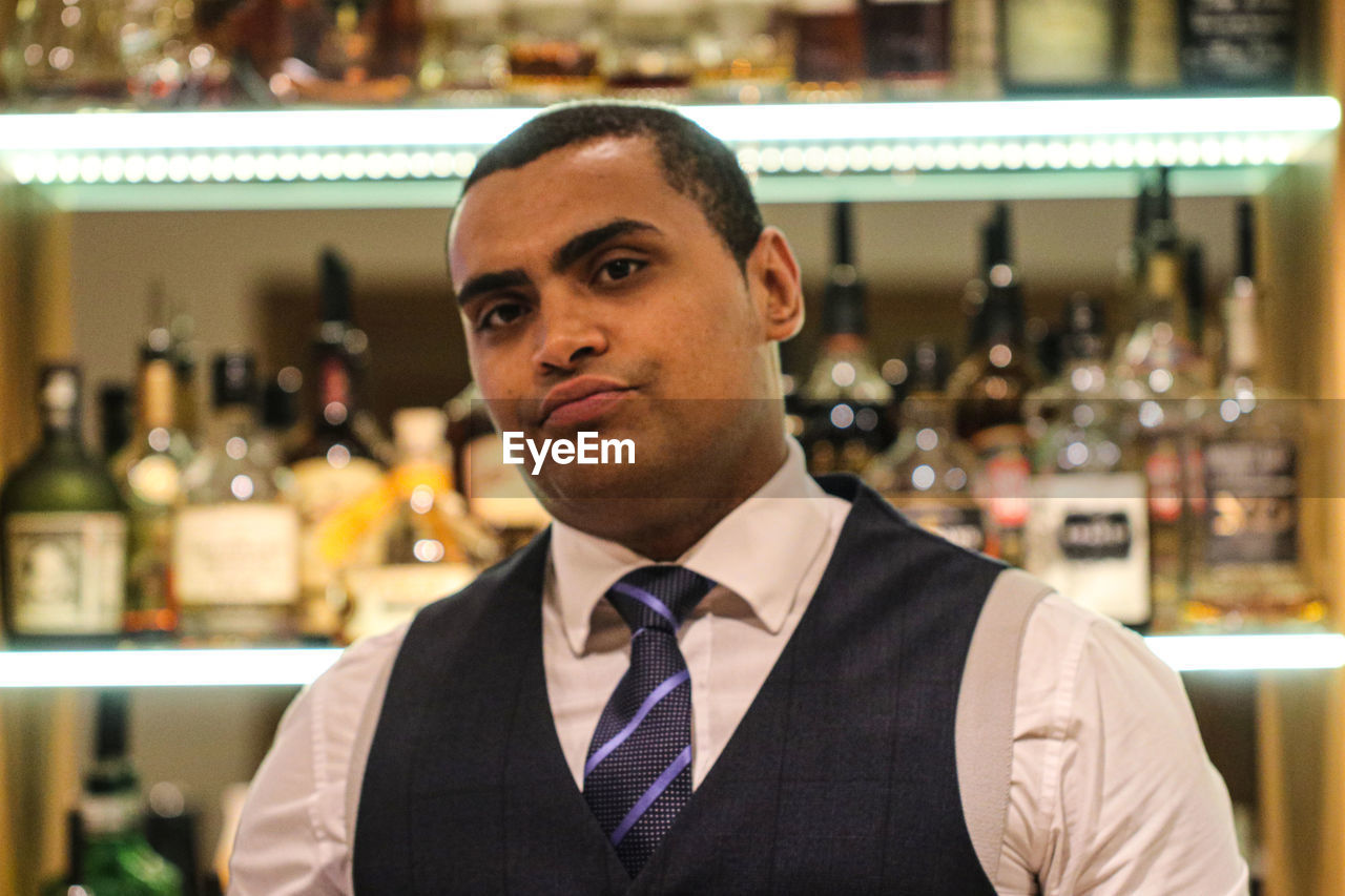 Close-up portrait of man in bar