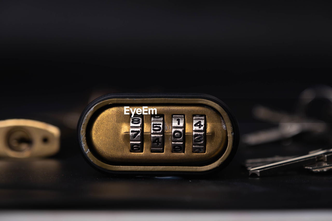 close-up of padlock with text on black background