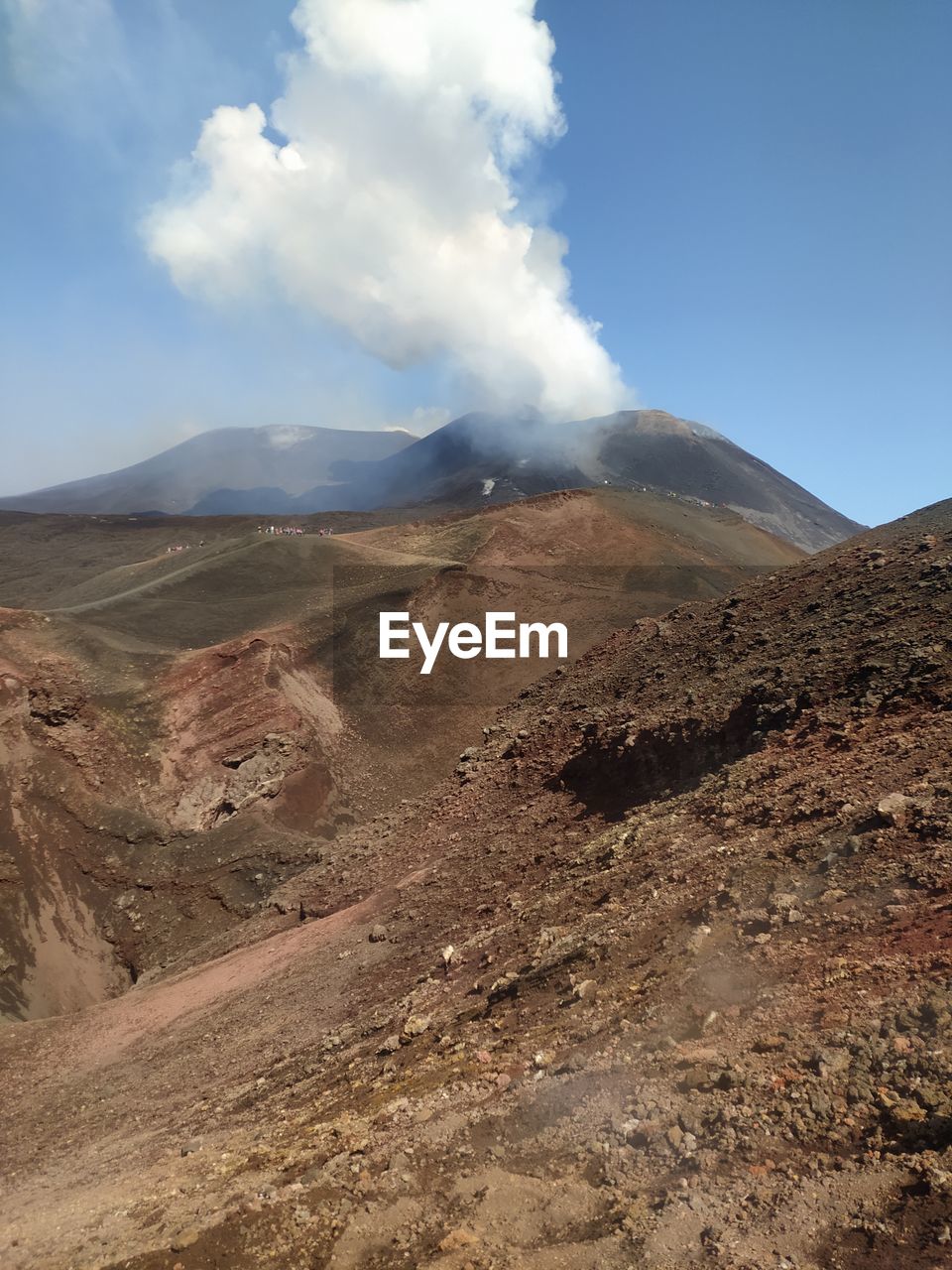 Scenic view of volcano's erruption against sky