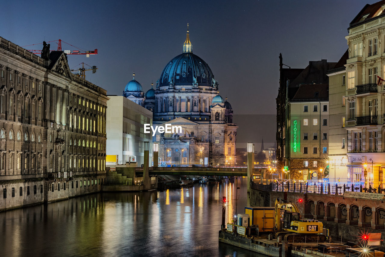 VIEW OF ILLUMINATED BUILDINGS AT NIGHT