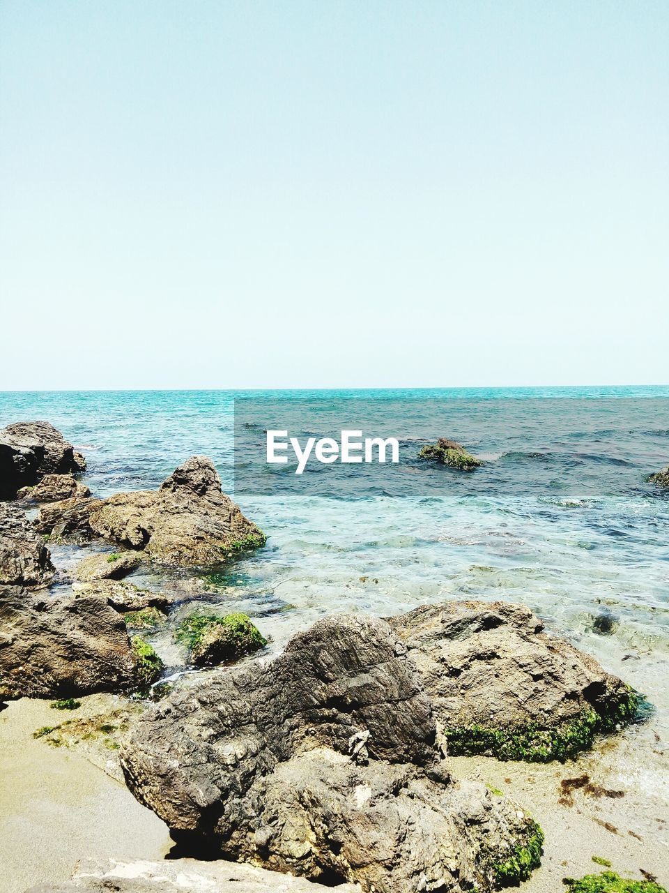 Scenic view of sea against clear sky