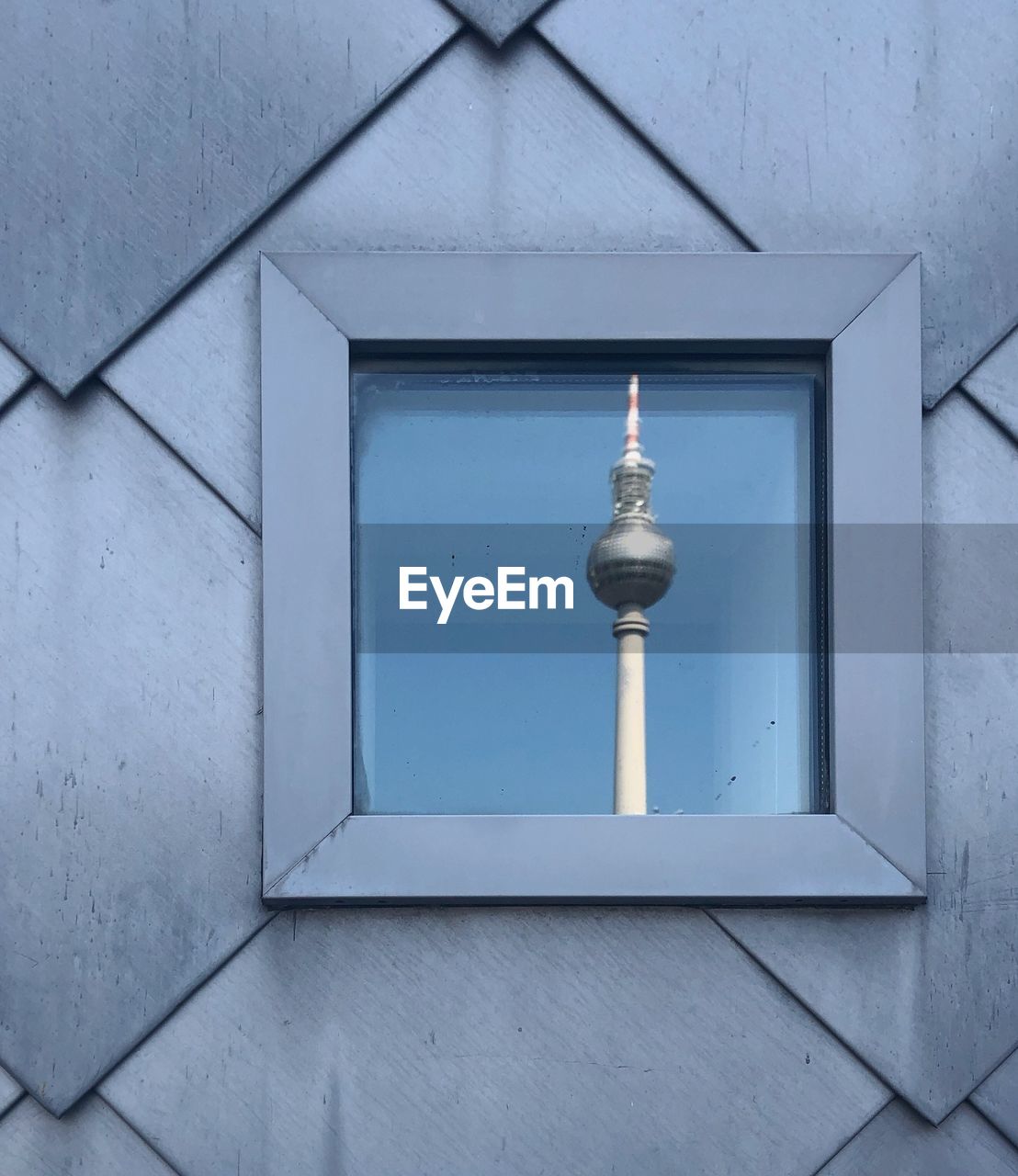 Window reflection of television tower in berlin