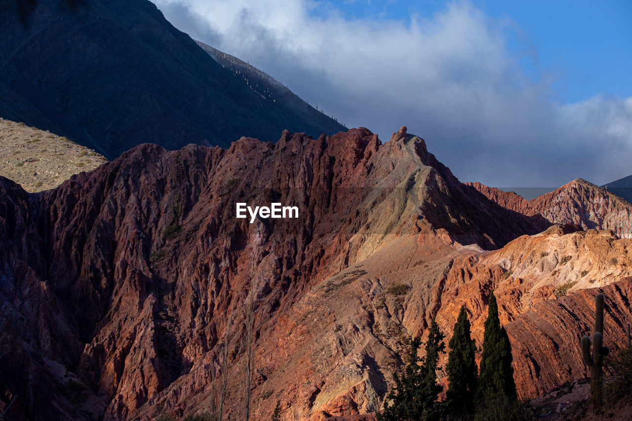 Panoramic view of rocky mountains against sky