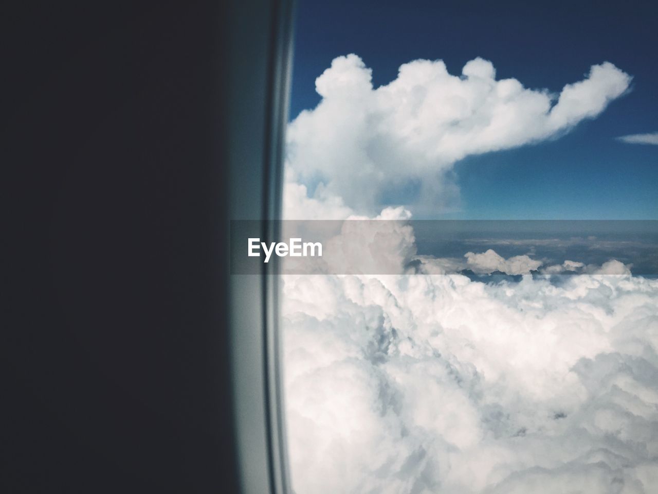 Idyllic view of cloudscape seen through airplane window