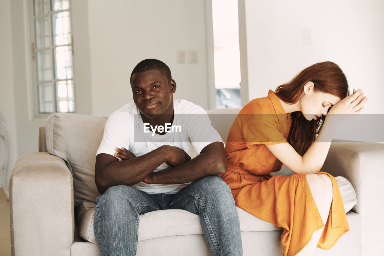 Young couple sitting on sofa