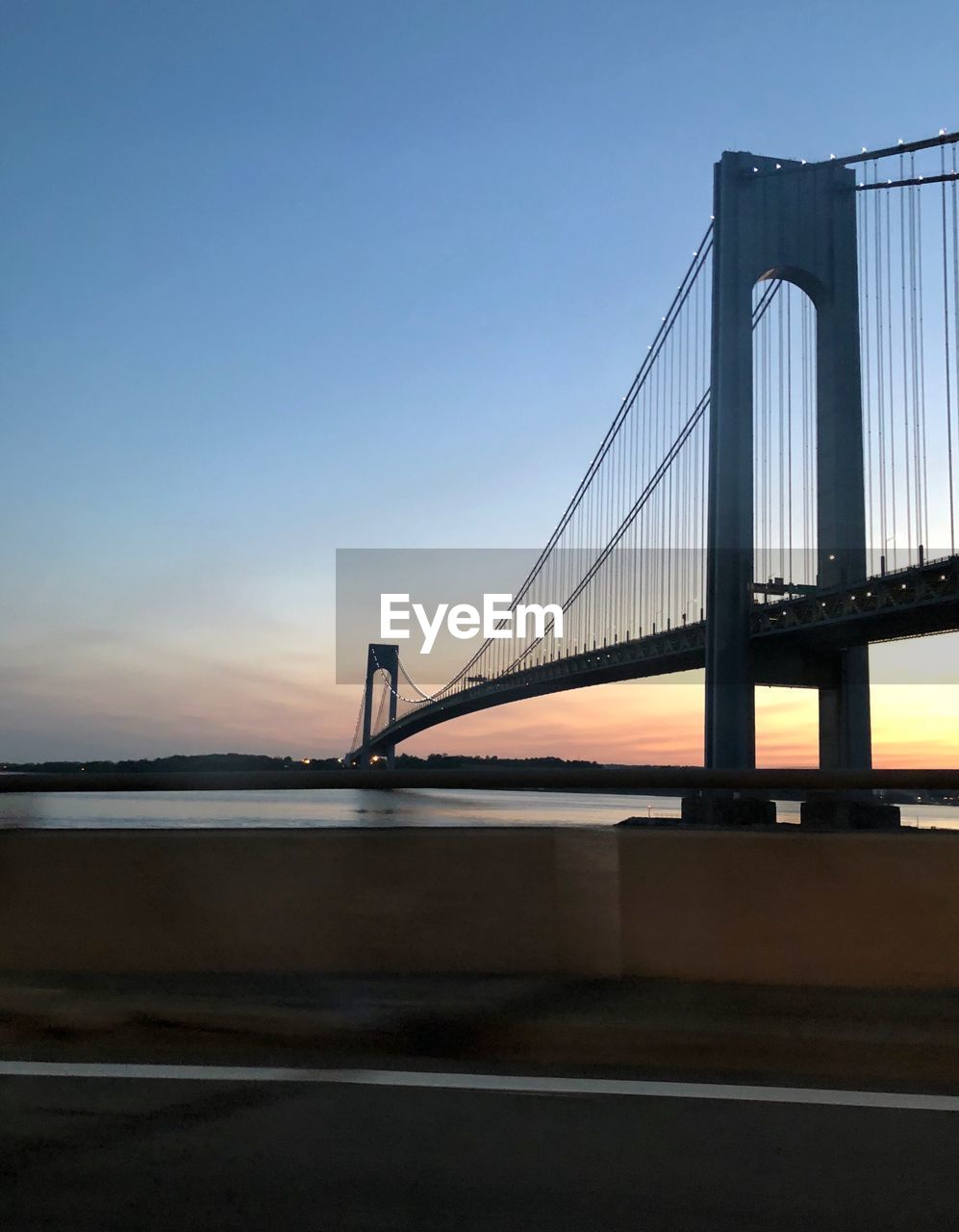 VIEW OF SUSPENSION BRIDGE AT SUNSET