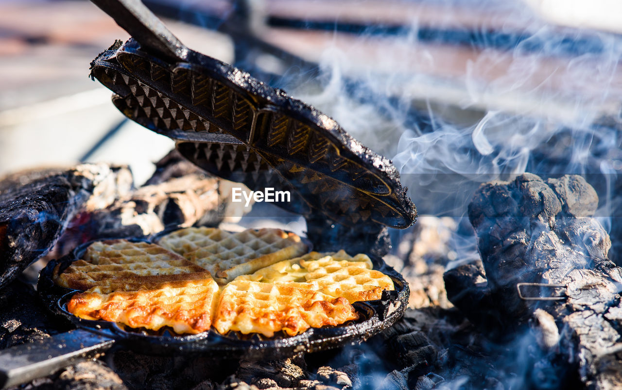 Waffle on metal over barbecue grill