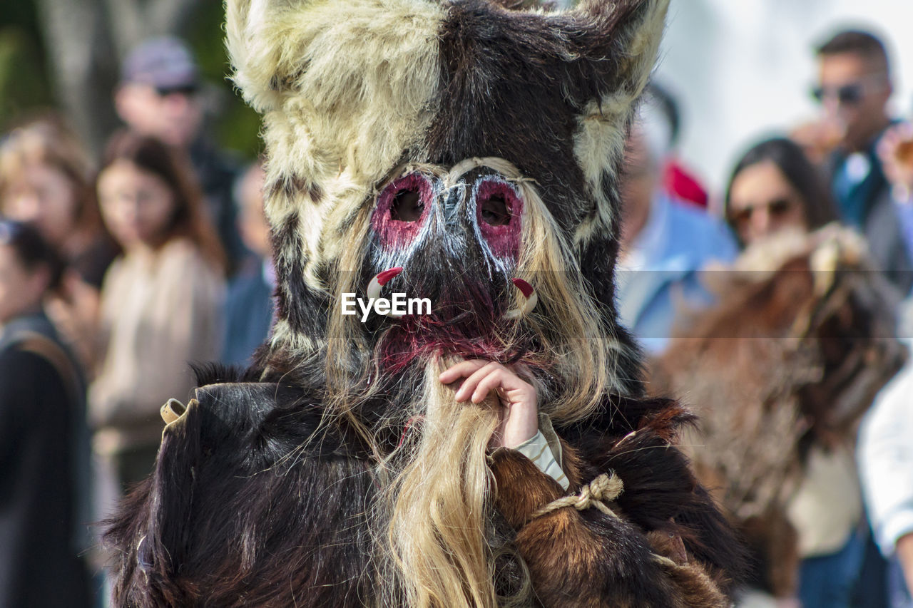 Close-up of man wearing mask during traditional festival