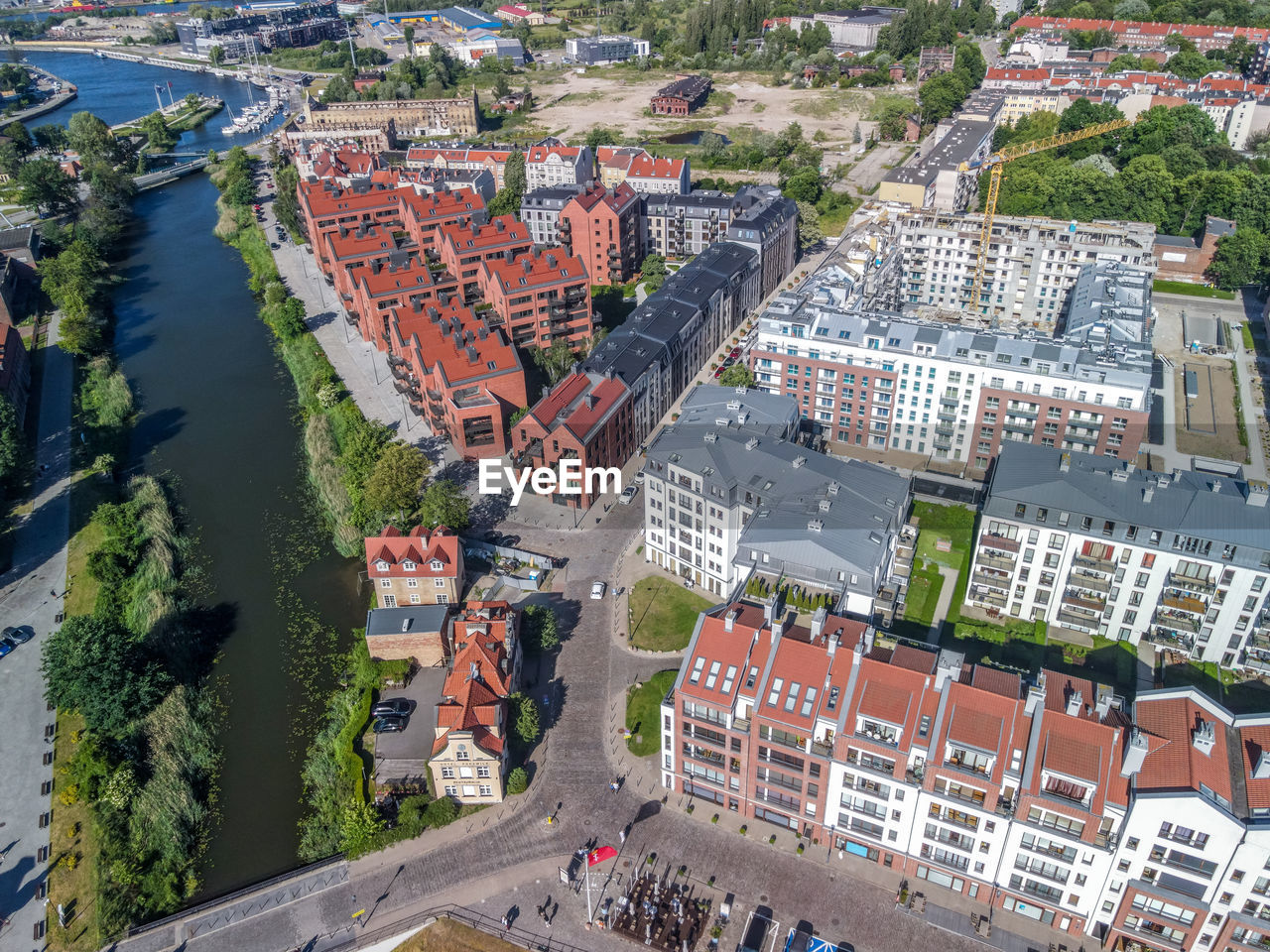 High angle view of street amidst buildings in town, aerial view on new apartments in gdansk, poland