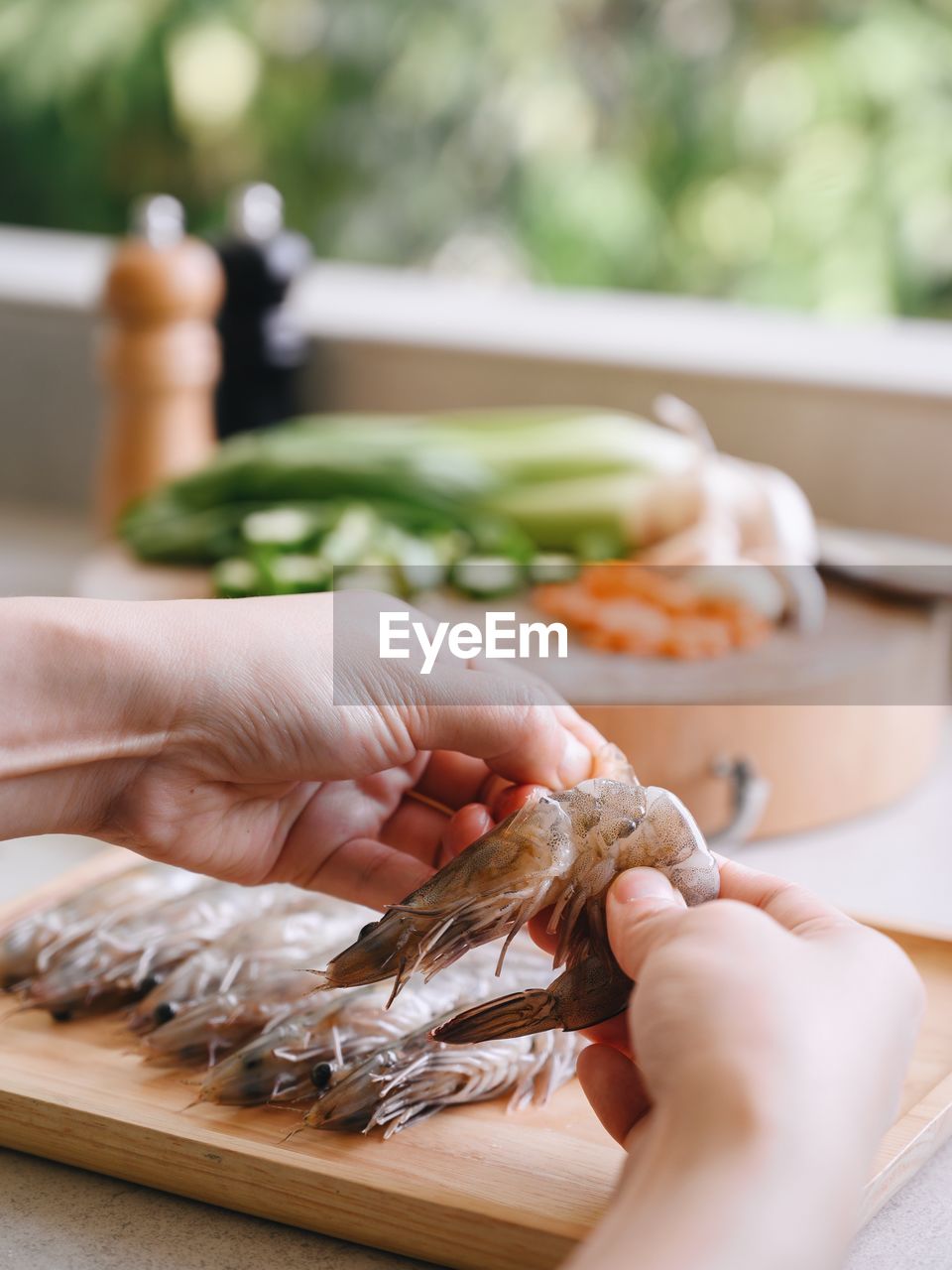 Cropped image of person preparing food