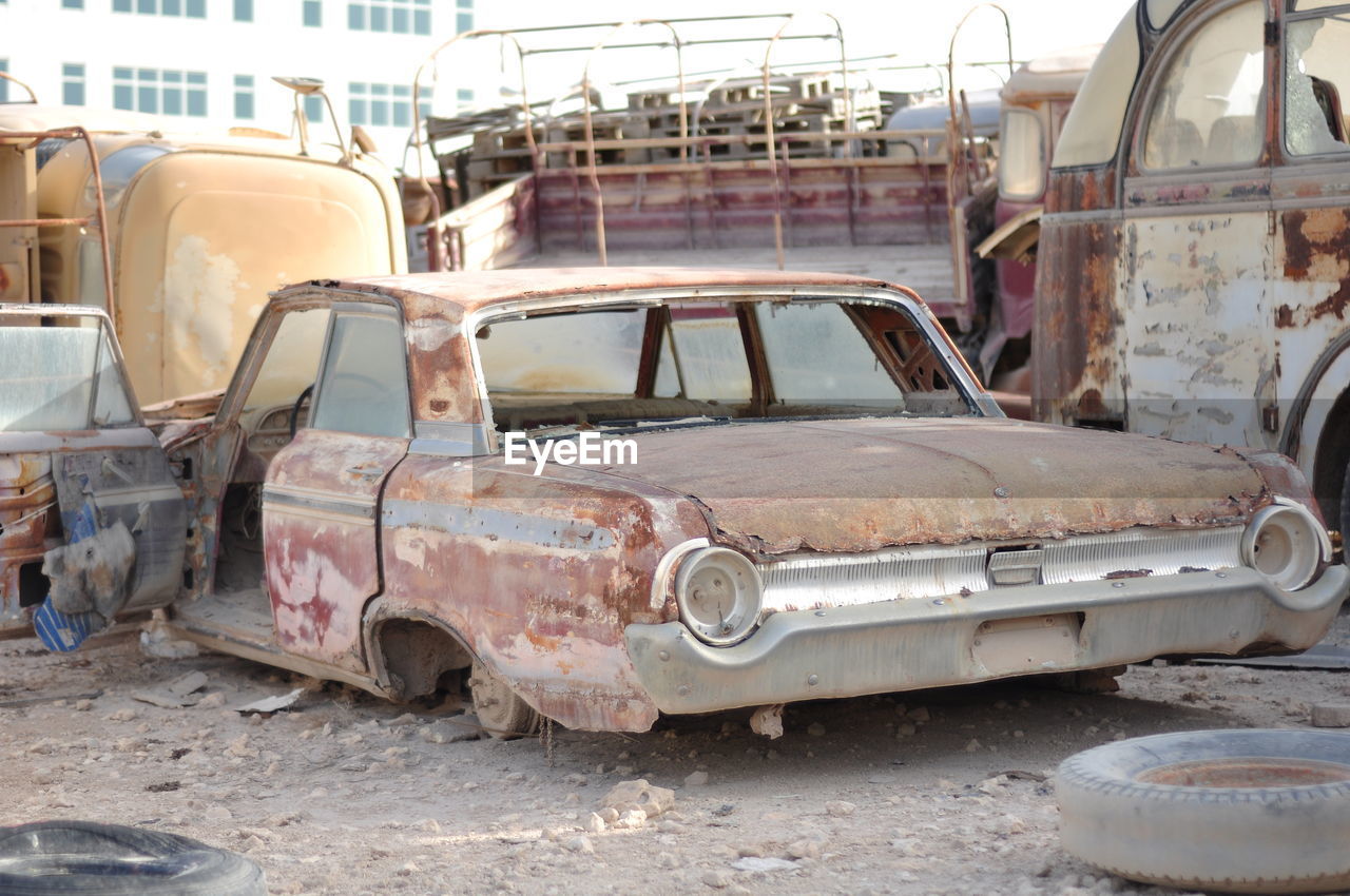 DAMAGED CAR IN ABANDONED BUS