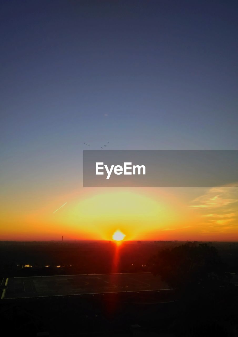 SILHOUETTE LANDSCAPE AGAINST SKY AT SUNSET