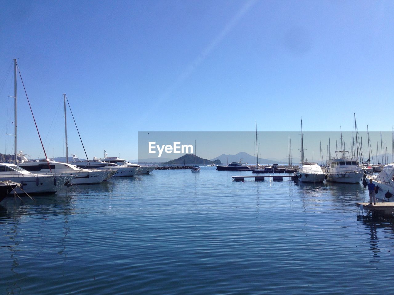 SAILBOATS MOORED IN MARINA