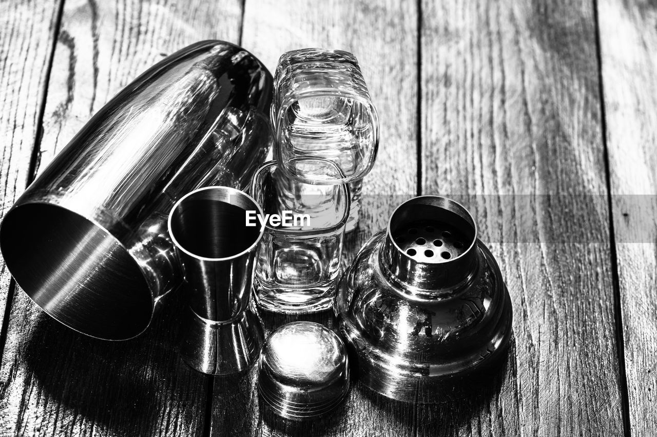 table, wood, black and white, still life photography, still life, high angle view, indoors, no people, monochrome photography, black, metal, bottle, monochrome, close-up, container, iron