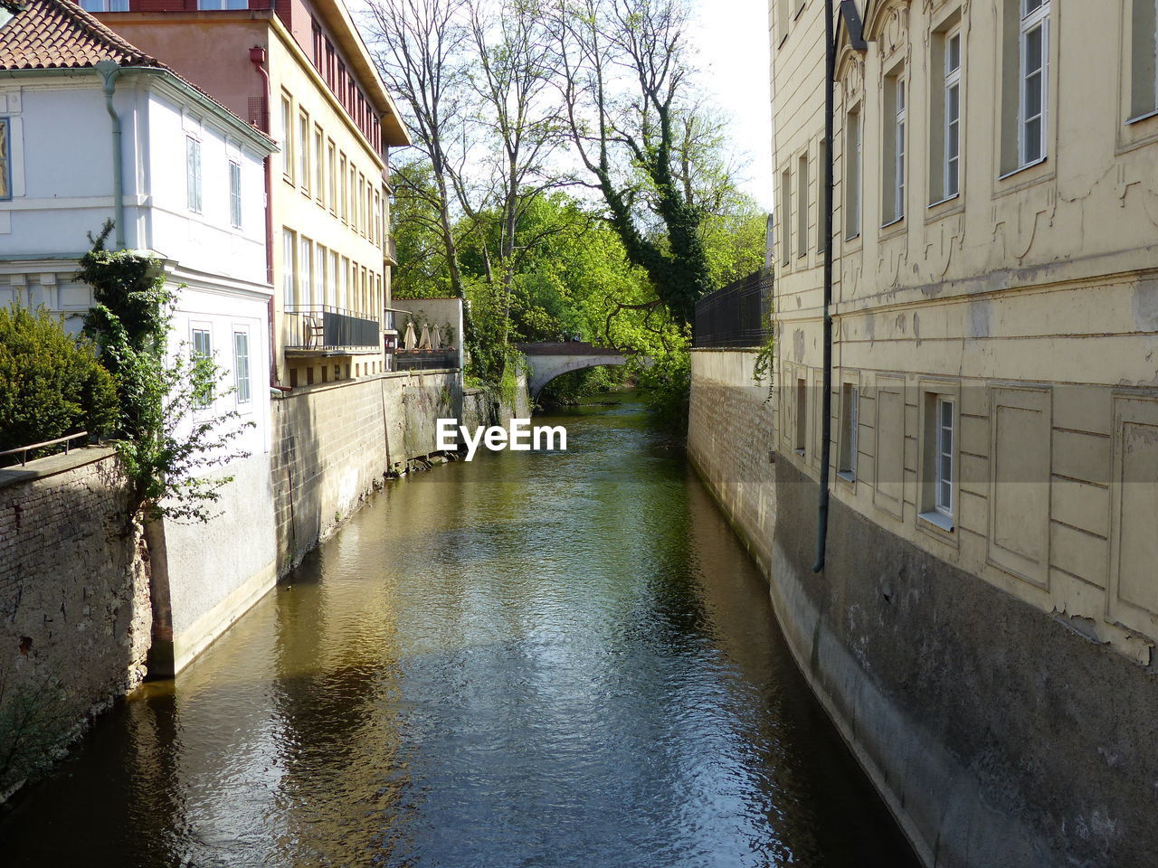 Canal amidst buildings in city