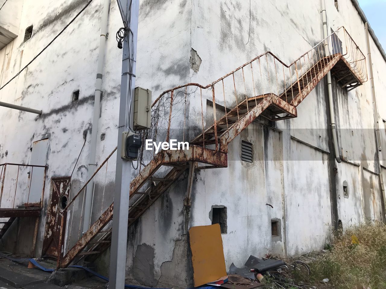 ABANDONED BUILDING AGAINST WALL