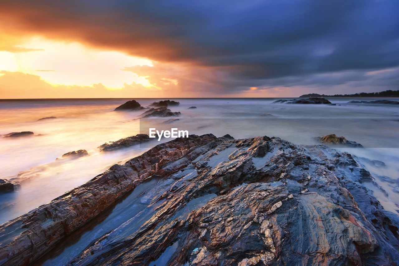 Beautiful sunrise over the rocky beach