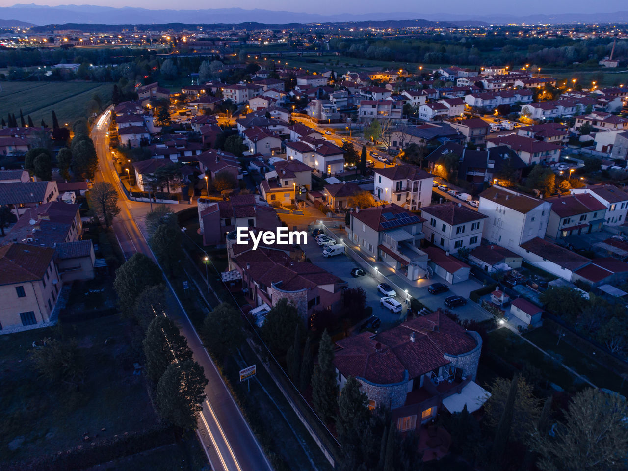 High angle view of illuminated buildings in city at night