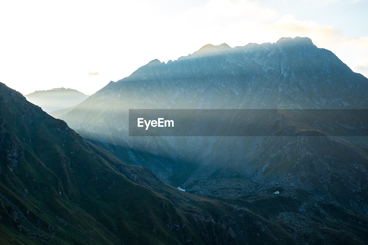 Scenic view of rocky mountains against sky, fagaras mountains, romania