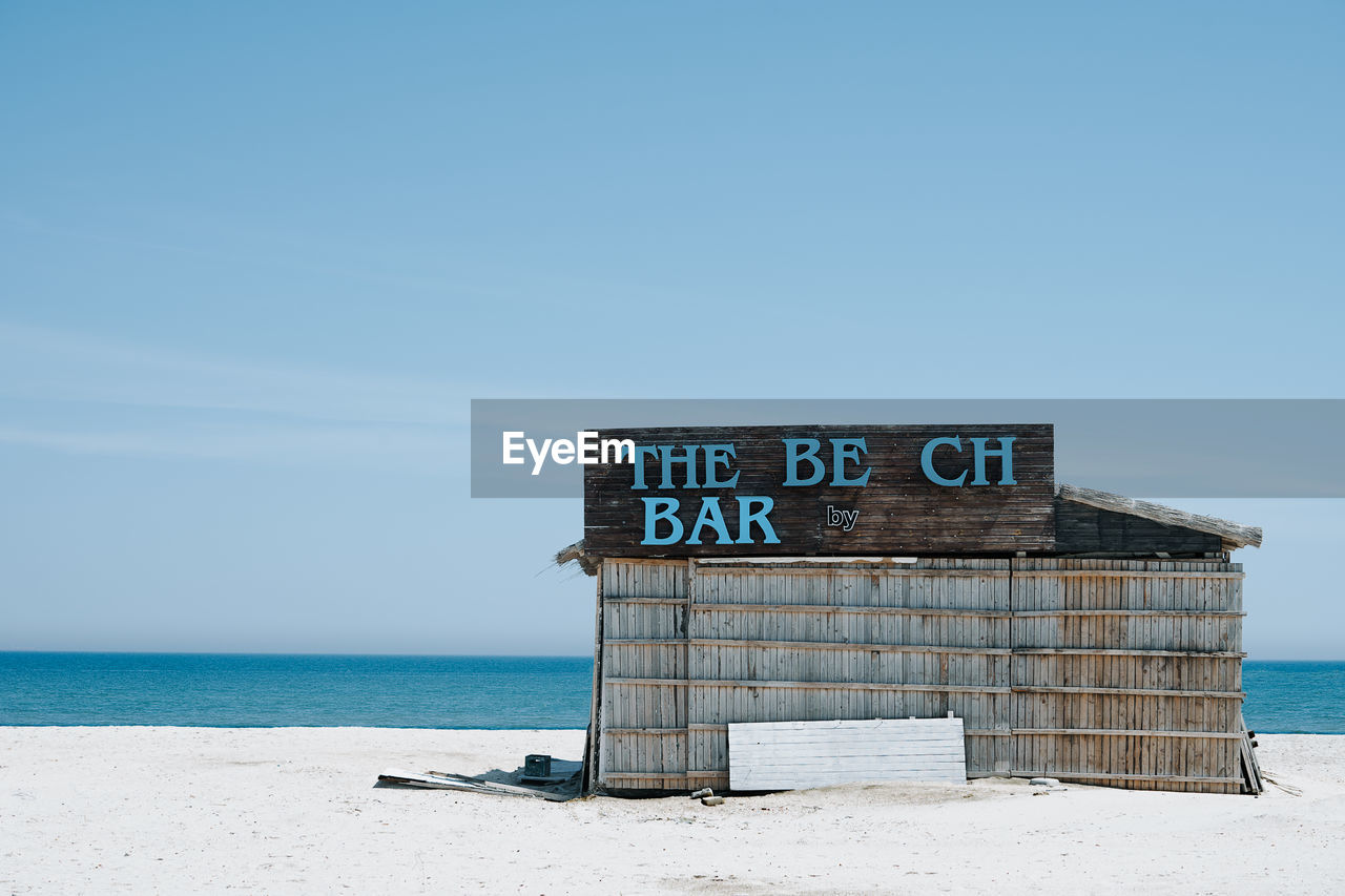 Bar at beach against clear sky
