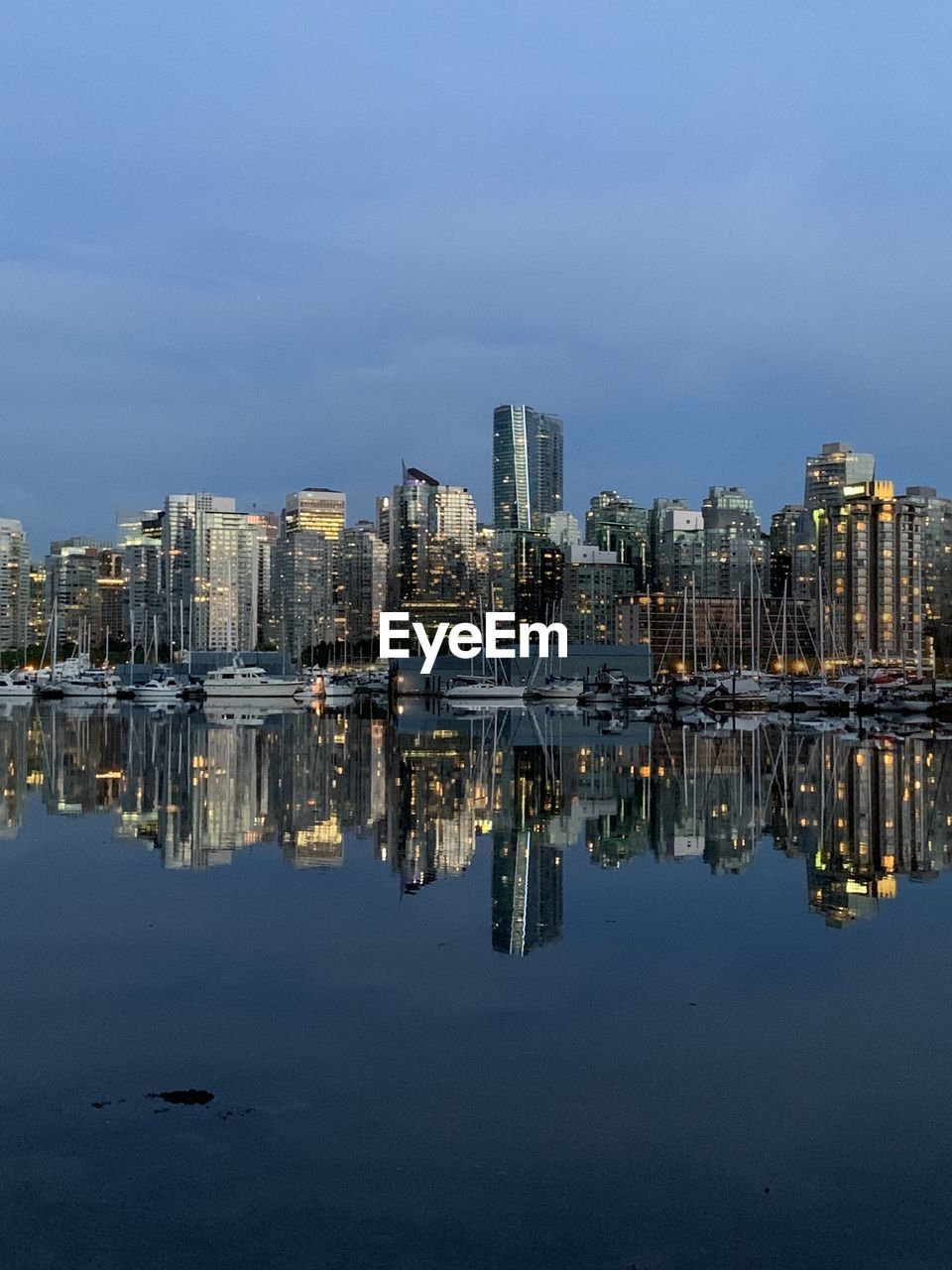 Panoramic view of sea and buildings against sky