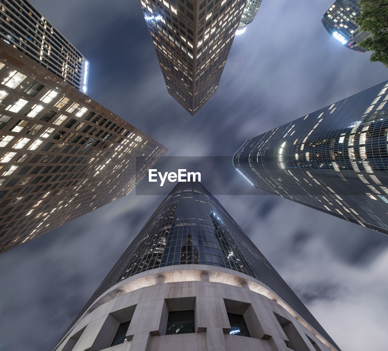 Looking up at skyscrapers in downtown los angeles at night