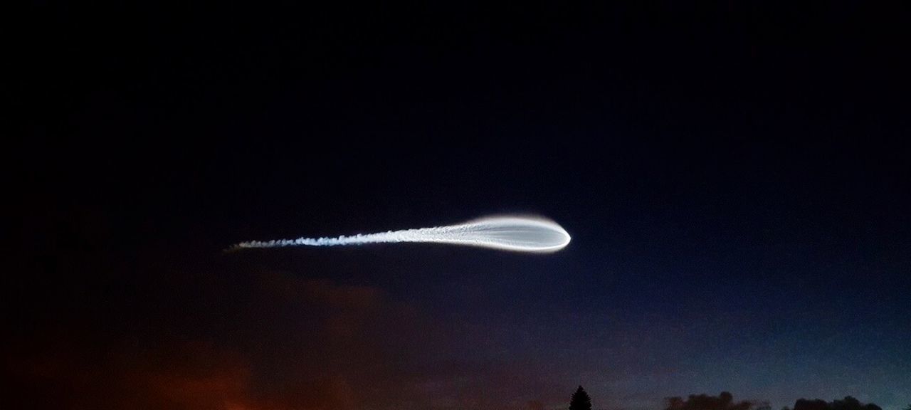 LOW ANGLE VIEW OF MOON IN THE DARK