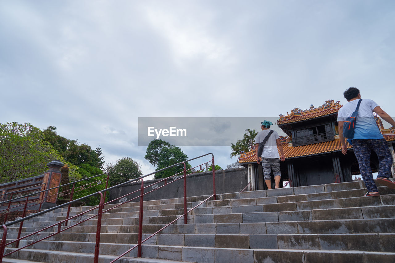 LOW ANGLE VIEW OF PEOPLE ON STEPS